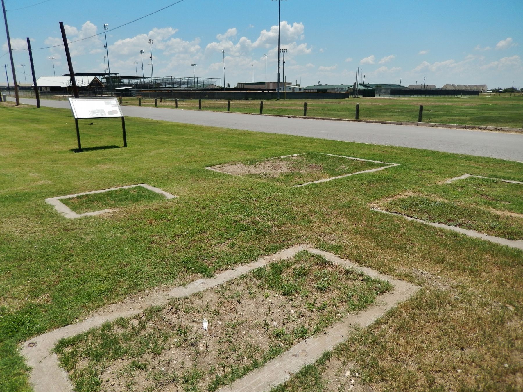 Internment Camp Marker (<i>wide view; foundation remains in foreground</i>) image. Click for full size.