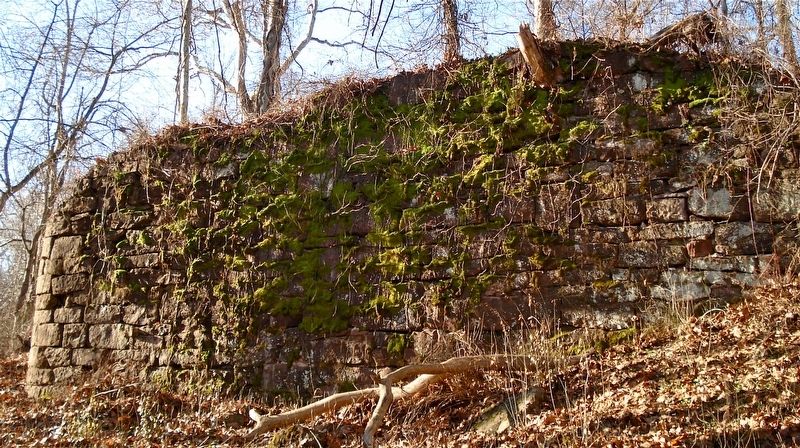 The abutment on the west riverbank is almost completely intact.. Click for full size. The abutment on the west riverbank is almost completely intact. image. Click for full size.