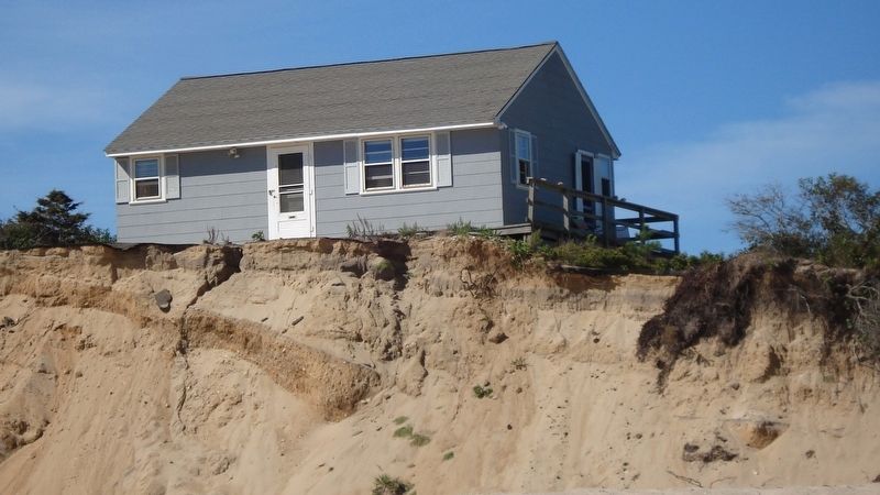 This house located 1 mile down the beach has so far survived. image. Click for full size.
