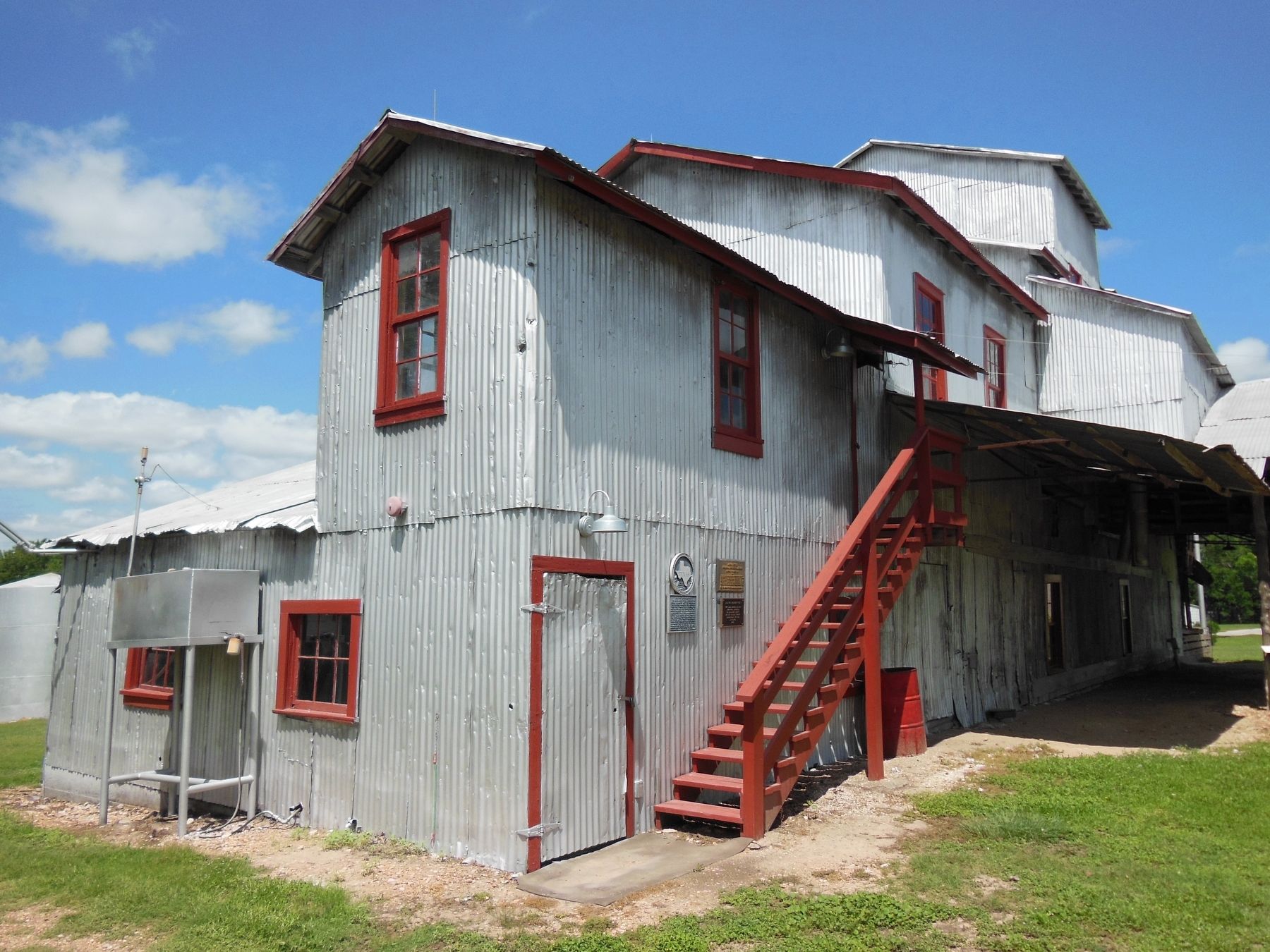Burton Farmers Gin 1914 Marker (<i>wide view; marker visible right of door</i>). Click for full size. Burton Farmers Gin 1914 Marker (<i>wide view; marker visible right of door</i>) image. Click for full size.