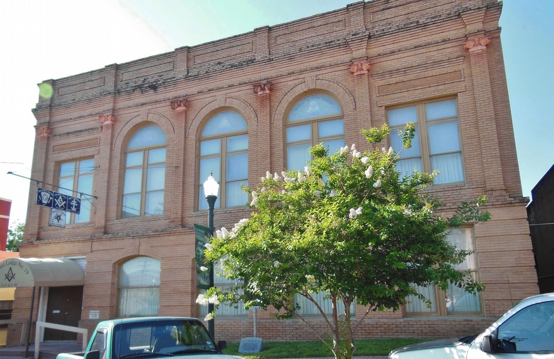 Forrest Lodge No. 19, A.F. & A.M. (<i>front view; marker visible at center behind shrub</i>) image. Click for full size.