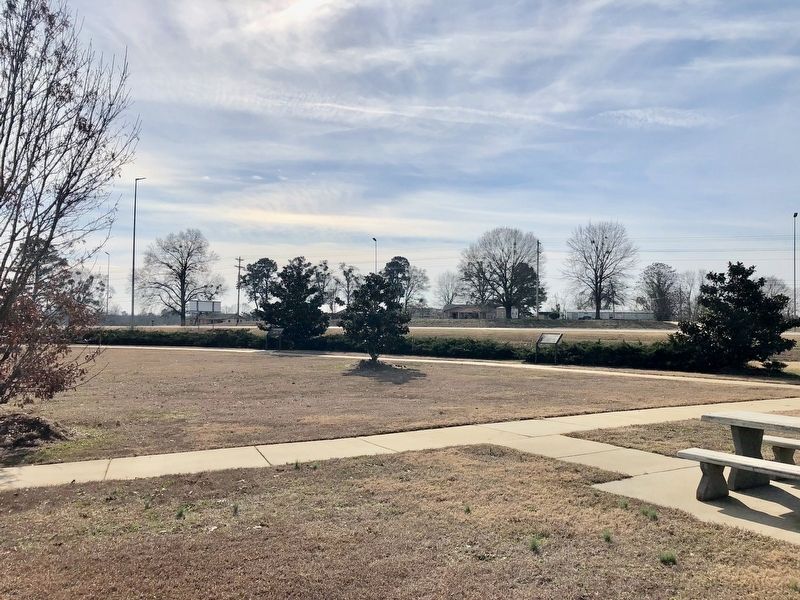 Marker can be seen on right along row of bushes.. Click for full size. Marker can be seen on right along row of bushes. image. Click for full size.