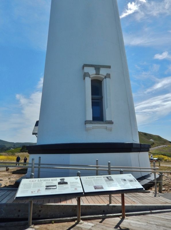 A Family Affair Marker (<i>wide view showing adjacent marker; lighthouse in background</i>) image. Click for full size.