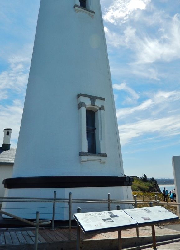 A Keeper's Work Marker (<i>wide view showing adjacent marker; lighthouse in background</i>) image. Click for full size.