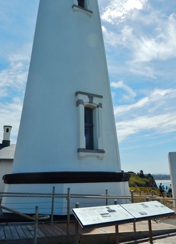 A Keeper's Work Marker (<i>wide view showing adjacent marker; lighthouse in background</i>). Click for full size. A Keeper's Work Marker (<i>wide view showing adjacent marker; lighthouse in background</i>) image. Click for full size.
