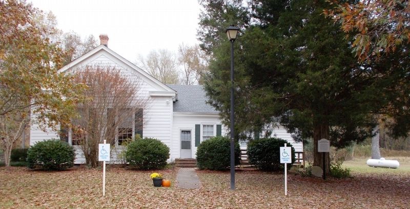 When facing the house, the stone and marker are on the right side. image. Click for full size.