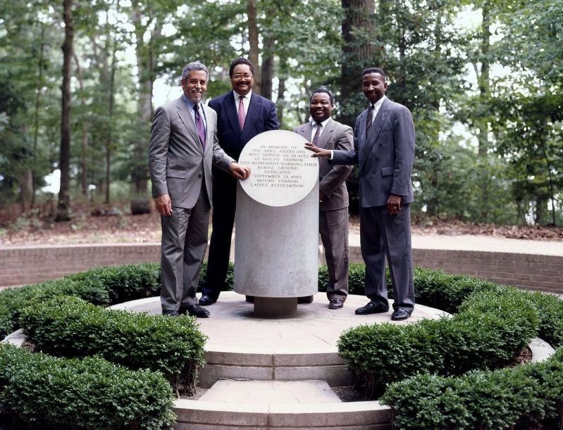 Decendents of Mt. Vernon slaves pose with the Slave Monument at Mt. Vernon. Click for full size. Decendents of Mt. Vernon slaves pose with the Slave Monument at Mt. Vernon image. Click for full size.