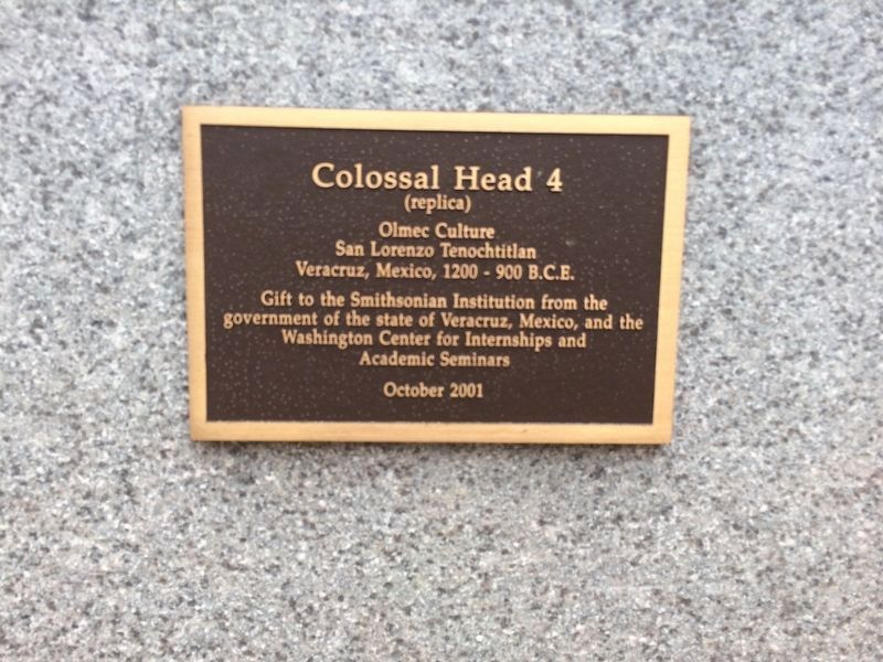 Closeup of plaque on Colossal Head 4 (replica) image. Click for full size.