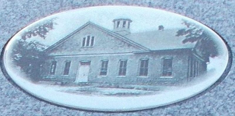 Detail of the school’s photo implanted on the monument. image. Click for full size.