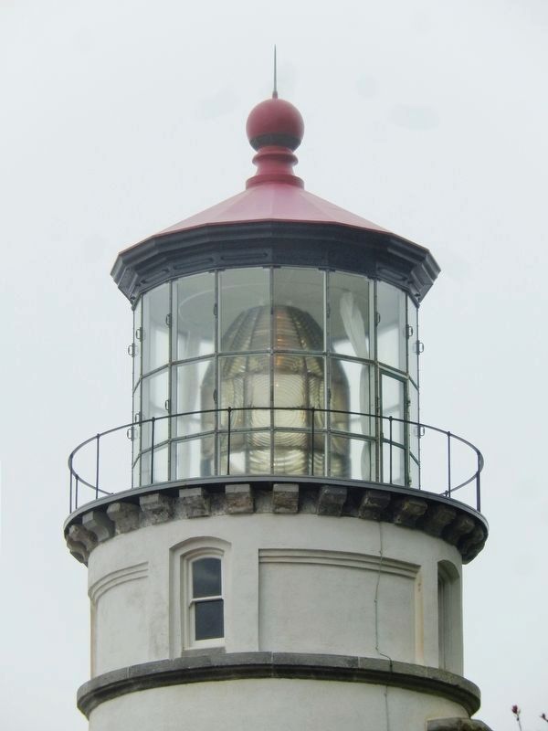 Lighthouse lens, gallery and railing image. Click for full size.