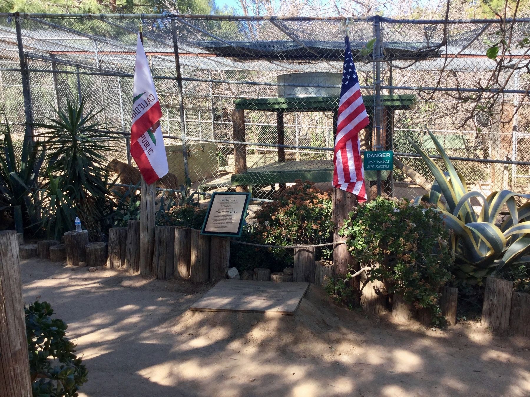 Firefighters Marker in front of lion cage. Click for full size. Firefighters Marker in front of lion cage image. Click for full size.