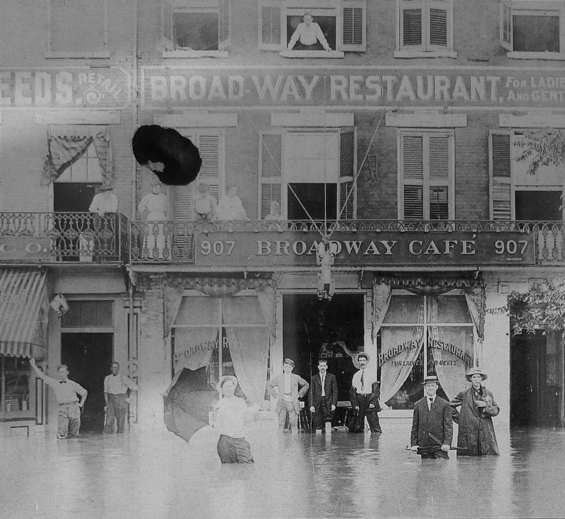 Marker detail: Store owners posed knee-deep in water on Broad Street, in 1908 image. Click for full size.