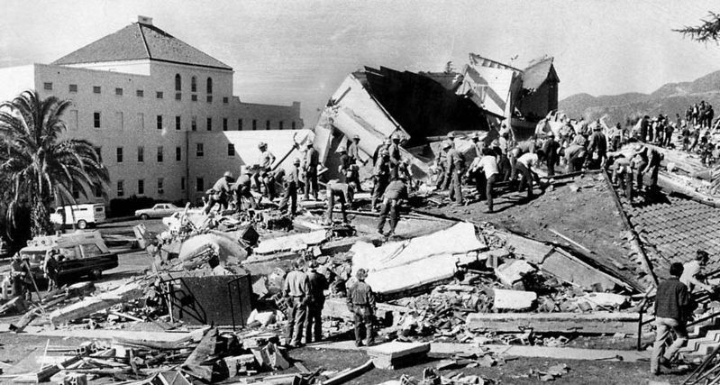 Rescuers digging through the rubble. Click for full size. Rescuers digging through the rubble image. Click for full size.