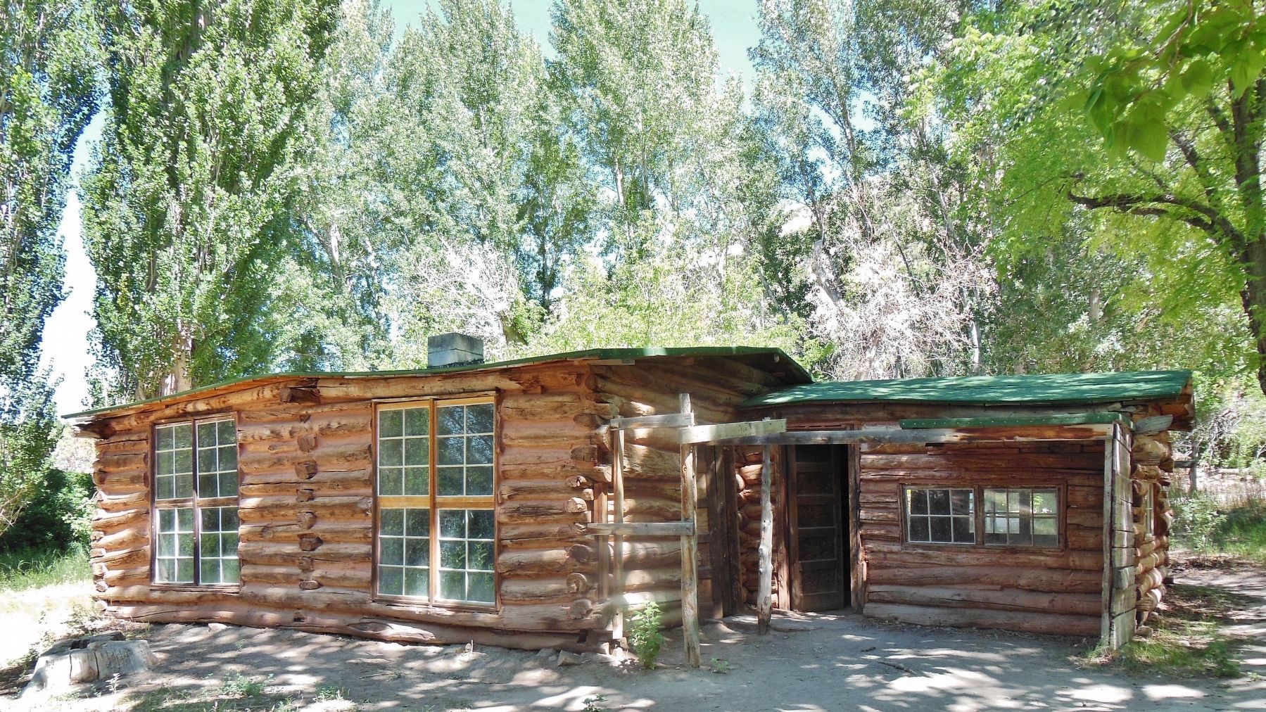 Josie Morris Homestead Cabin (<i>surrounded by the trees she planted</i>) image. Click for full size.