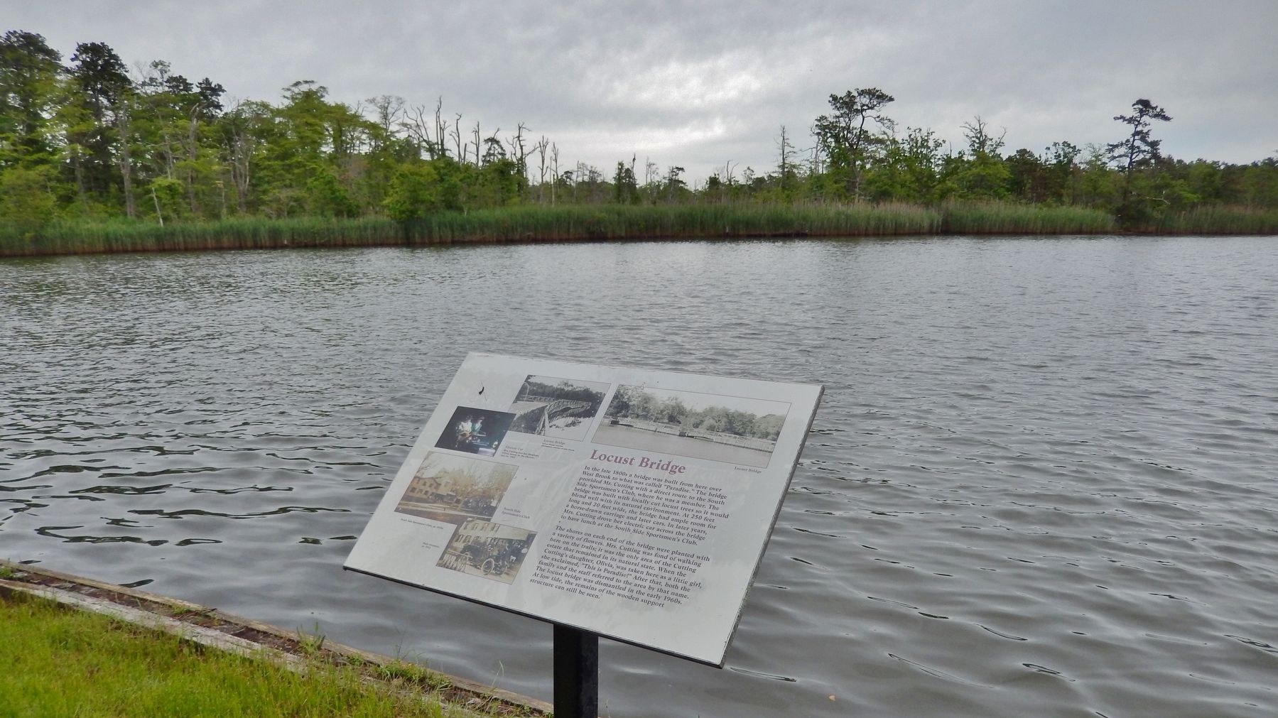 Locust Bridge Marker (<i>wide view; Connetquat River & former bridge site in background</i>). Click for full size. Locust Bridge Marker (<i>wide view; Connetquat River & former bridge site in background</i>) image. Click for full size.