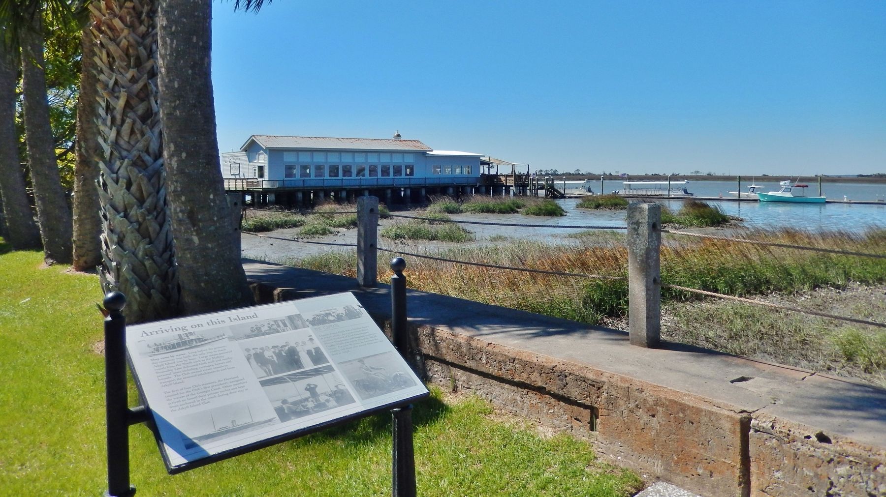 Arriving on This Island Marker (<i>wide view; Jekyll Island Wharf in background</i>) image. Click for full size.