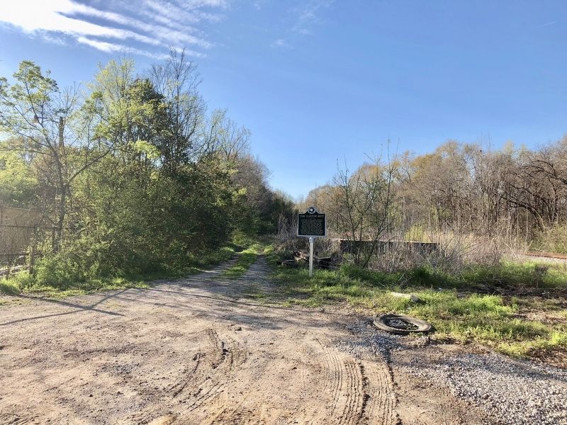 The Clinton Riot Marker near old works and railroad tracks.. Click for full size. The Clinton Riot Marker near old works and railroad tracks. image. Click for full size.