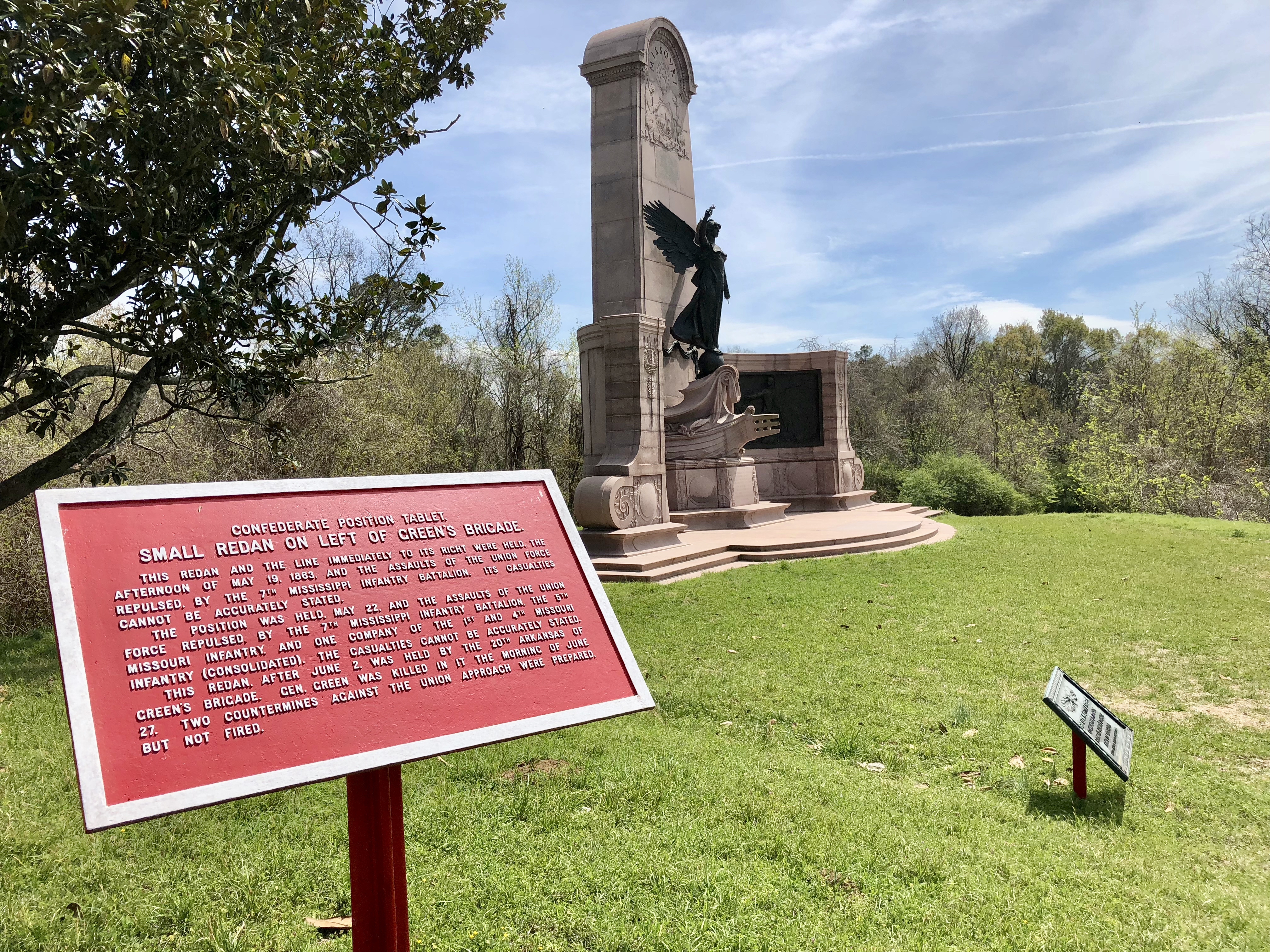 View of marker with Missouri Monument in background.