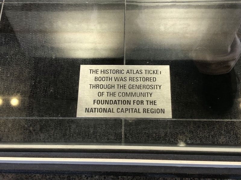 Sign at the bottom of the historic ticket booth image. Click for full size.