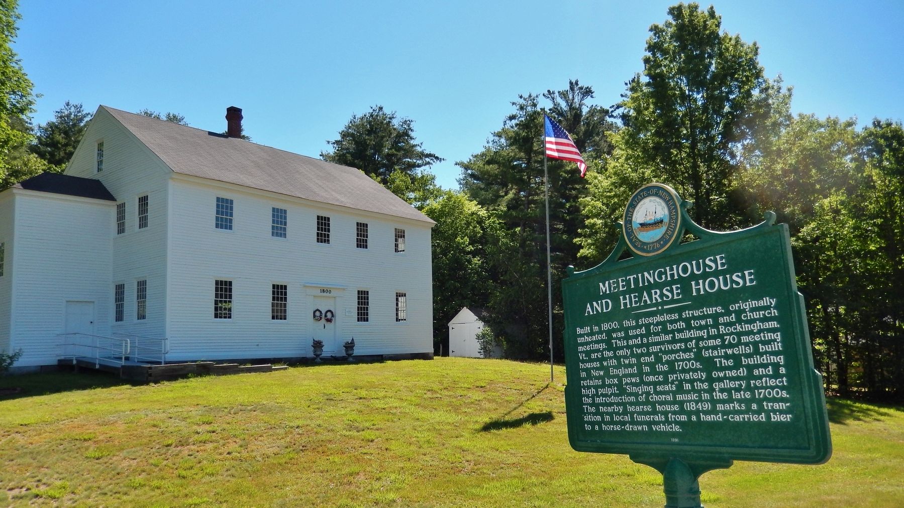 Meeting House and Hearse House Marker (<i>wide view; Meeting House in background</i>) image. Click for full size.