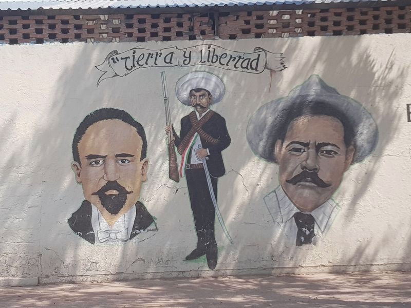 A nearby mural of Zapata flanked by Madero and Villa image. Click for full size.