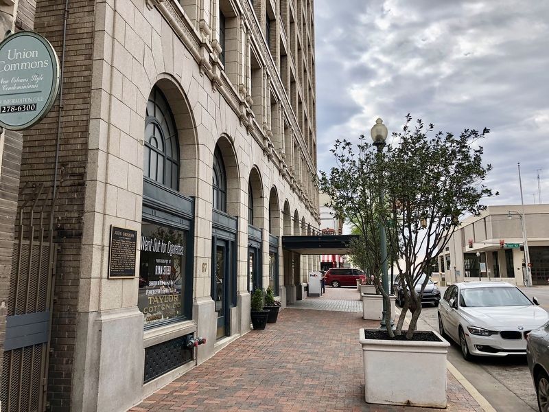 John Grisham marker on the left, mounted to wall of Cotton Exchange. image. Click for full size.