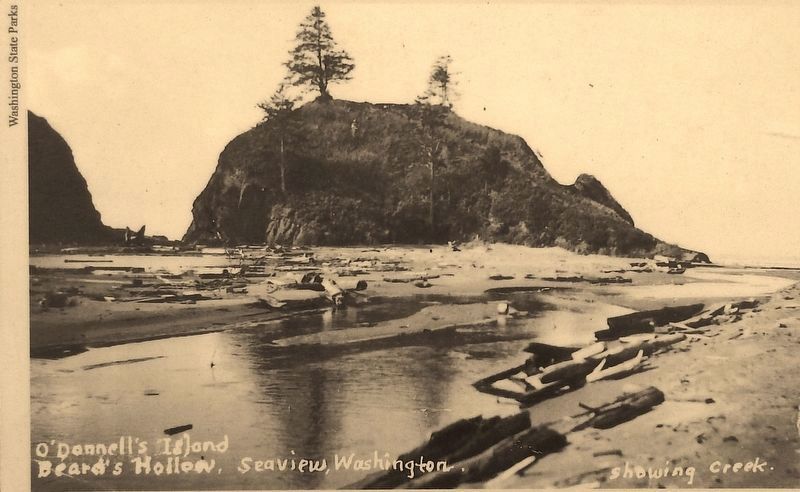 Marker detail: The waves no longer crash at the base of O'Donell's Island, nor carve more caves. image. Click for full size.