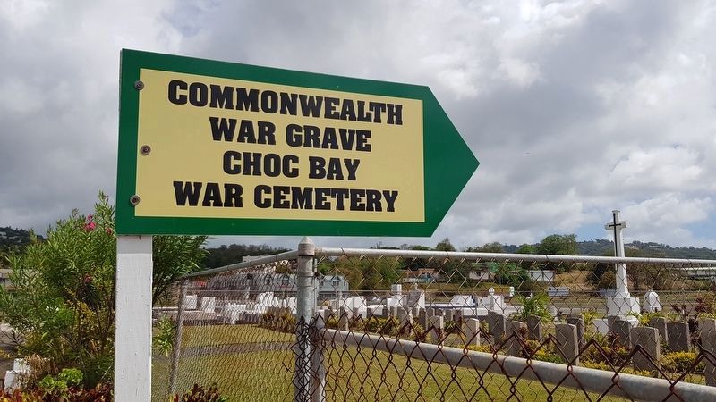 Choc Bay War Cemetery entrance sign. Click for full size. Choc Bay War Cemetery entrance sign image. Click for full size.