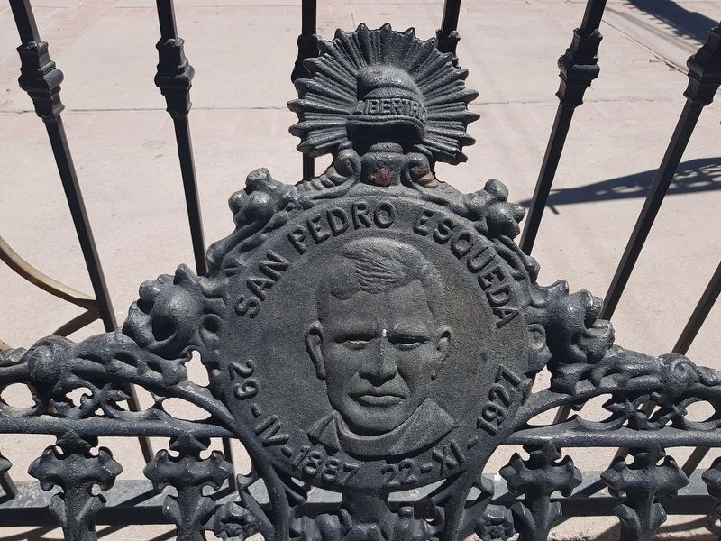 A nearby park bench with an image of Saint Pedro Esqueda image. Click for full size.