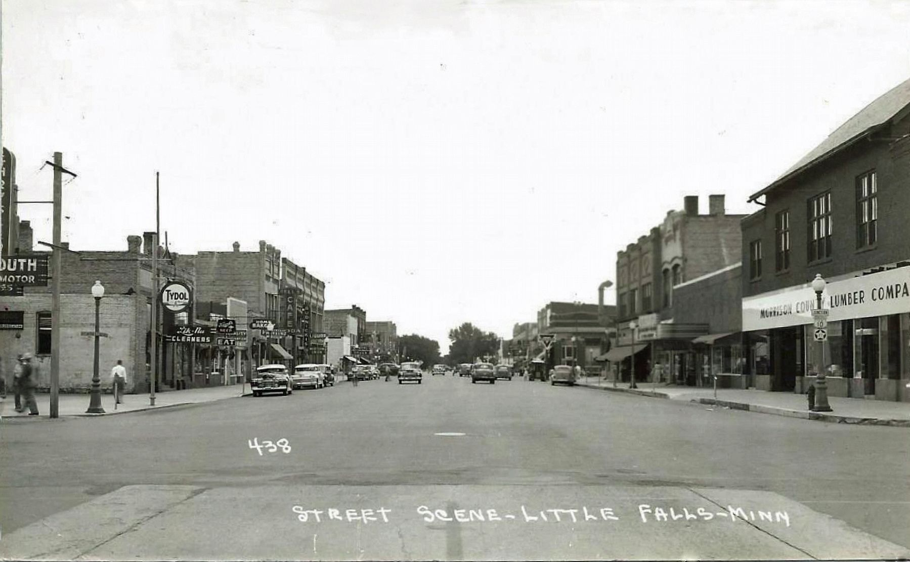<i>Street Scene - Little Falls - Minn.</i> - Looking north, W. Tonn Block on the left image. Click for full size.