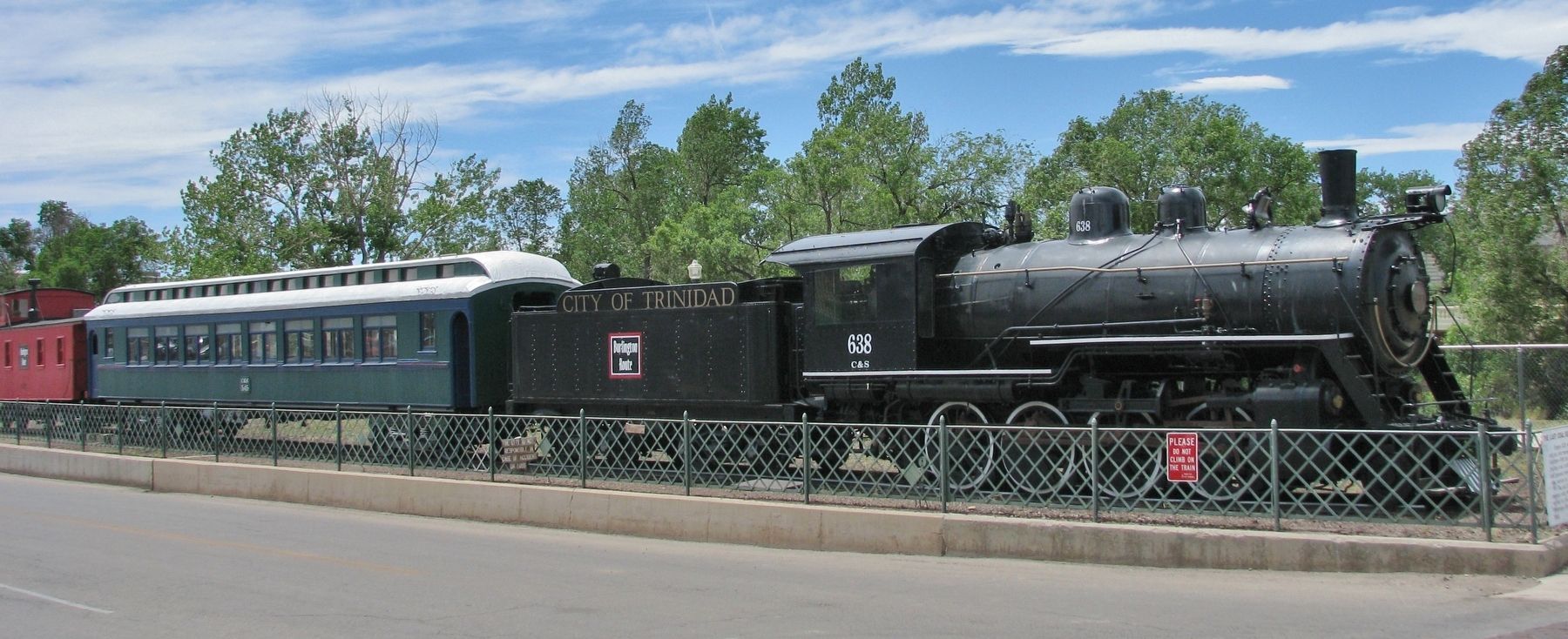 Locomotive, tender, car & caboose exhibit (<i>wide view; marker partially visible far right</i>). Click for full size. Locomotive, tender, car & caboose exhibit (<i>wide view; marker partially visible far right</i>) image. Click for full size.