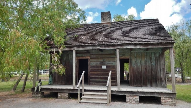 The Slave Quarters Marker (<i>wide view; marker visible at center of building, between doors</i>) image. Click for full size.