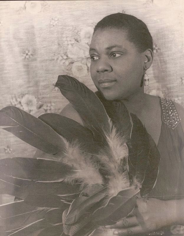 <i>Portrait of Bessie Smith holding feathers</i> image. Click for full size.