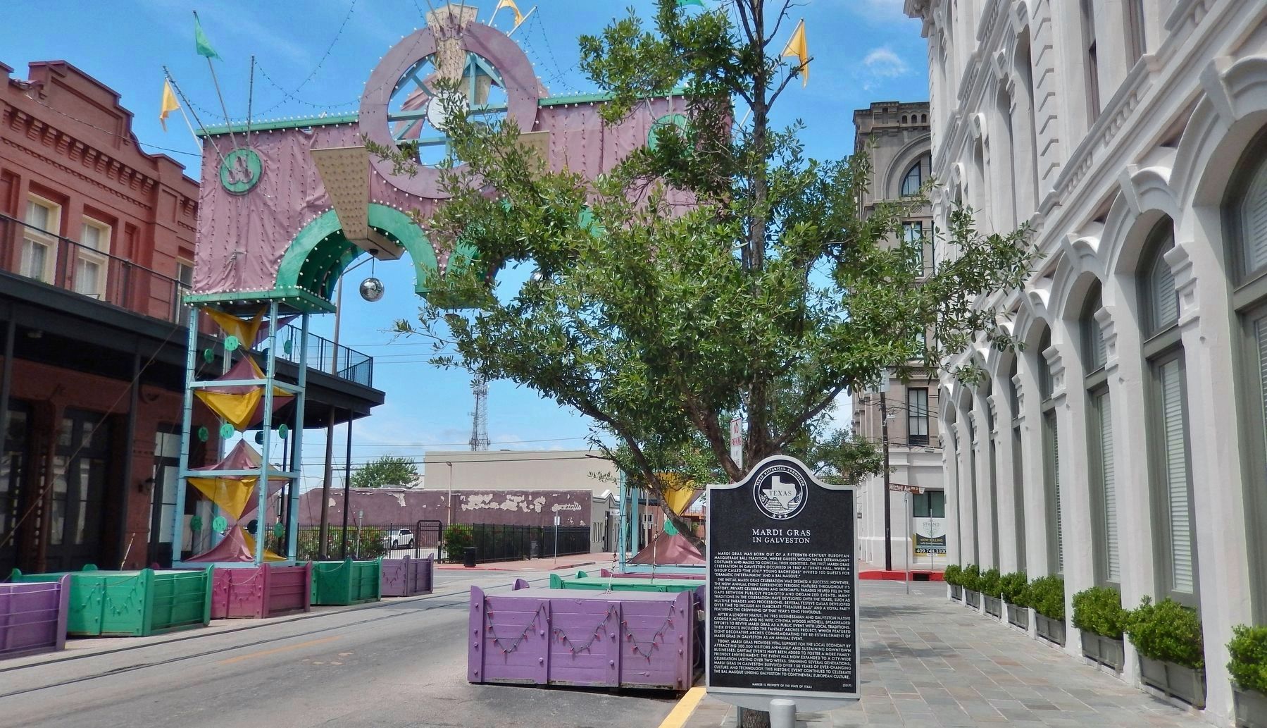 Mardi Gras in Galveston Marker (<i>wide view; showing Mardi Gras Arch in street at left</i>) image. Click for full size.