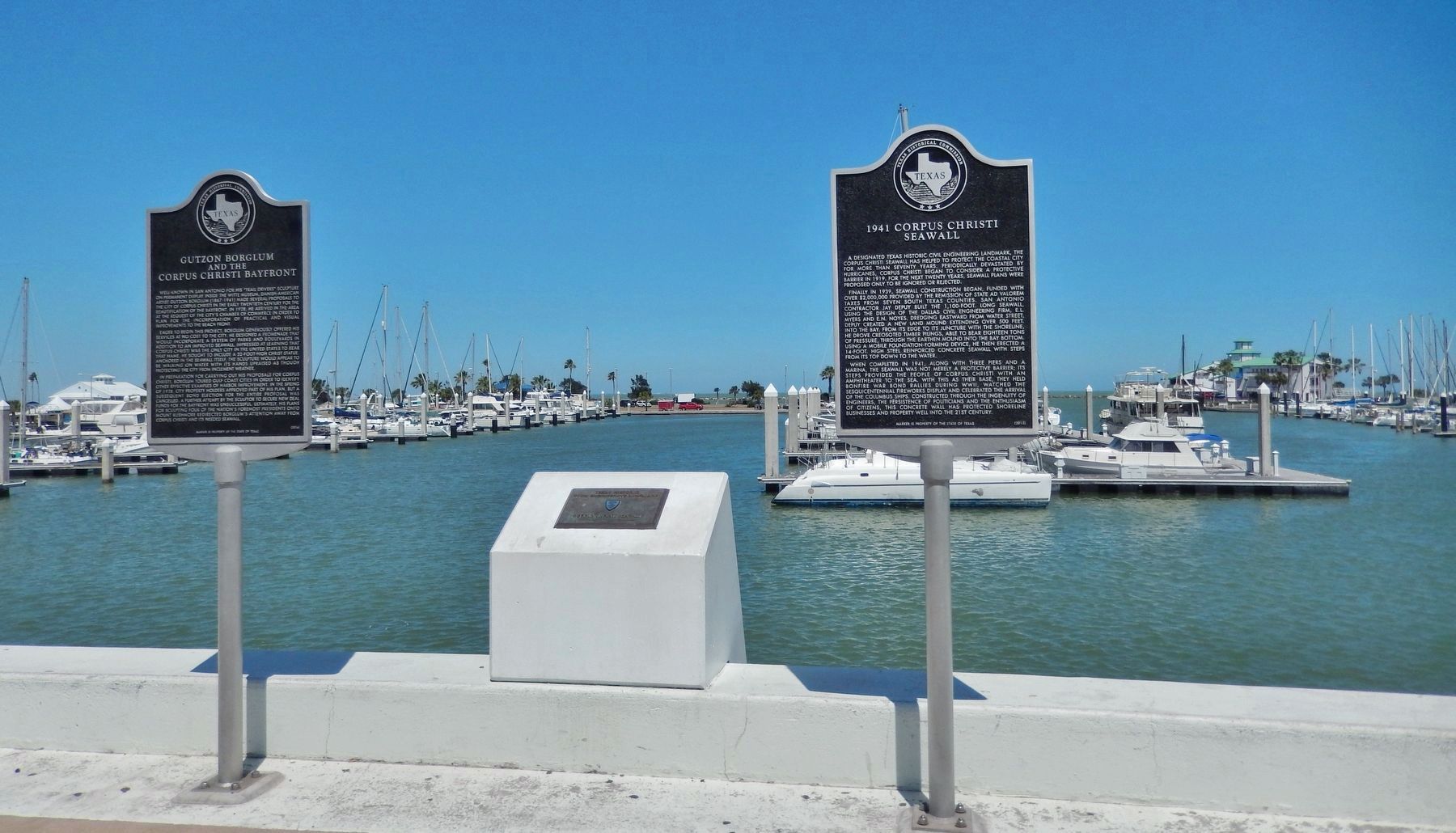 1941 Corpus Christi Seawall Marker (<i>wide view; plaque in center & adjacent marker far left</i>). Click for full size. 1941 Corpus Christi Seawall Marker (<i>wide view; plaque in center & adjacent marker far left</i>) image. Click for full size.