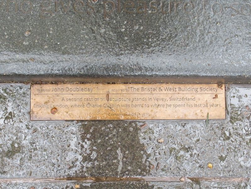 The small plaque at the base of the Charlie Chaplin Statue image. Click for full size.