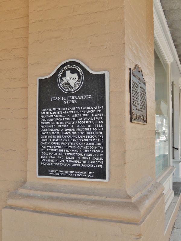 Juan H. Fernandez Store Marker (<i>tall view; northeast corner of building; facing Adams Street</i>) image. Click for full size.