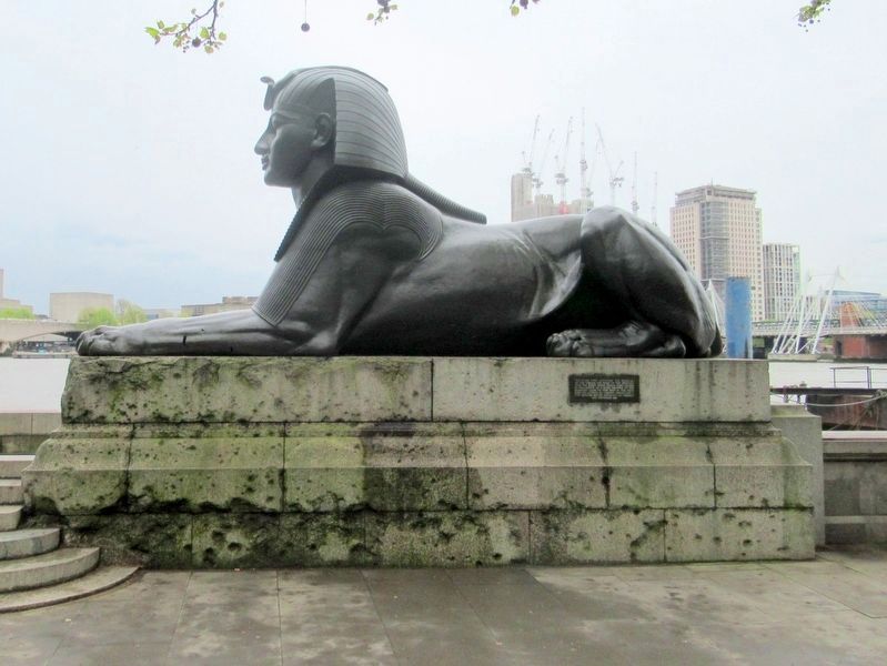 Bronze Sphinx flanking the Obelisk image. Click for full size.