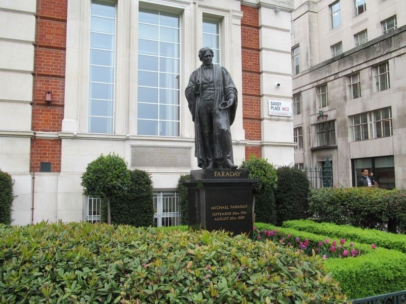 Statue of Michael Faraday in front of the Institution of Engineering and Technology and the Marker image. Click for full size.