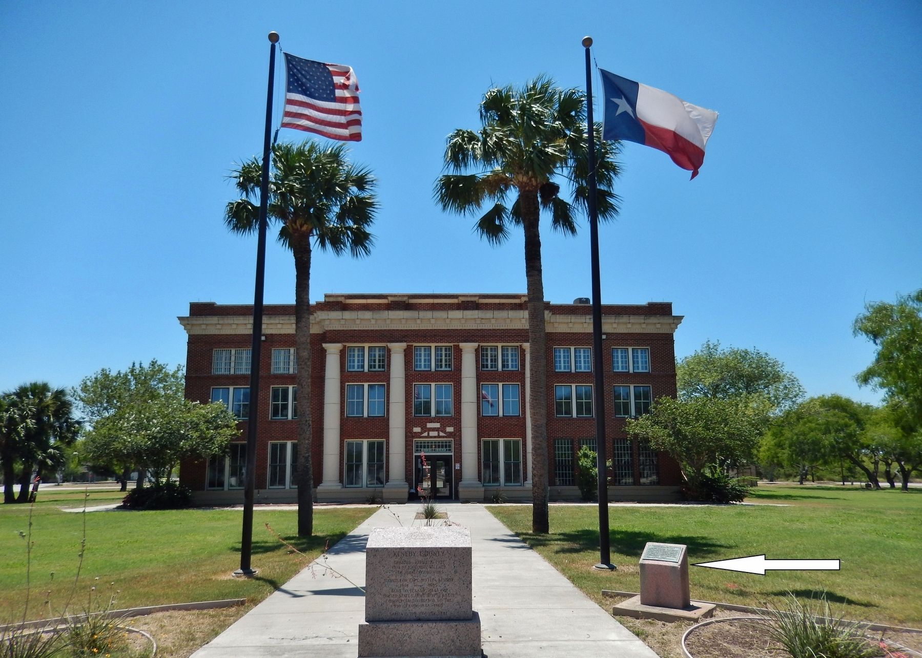 Riviera - 1687 Marker (<i>wide view; Kenedy County Courthouse in background - marker at right</i>). Click for full size. Riviera - 1687 Marker (<i>wide view; Kenedy County Courthouse in background - marker at right</i>) image. Click for full size.