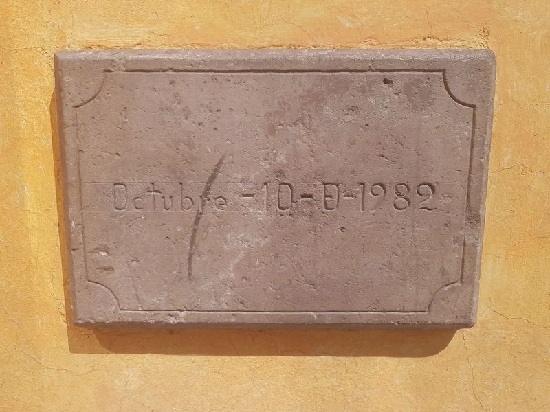 A dedicatory marker on the Sagrada Familia Catholic Church image. Click for full size.
