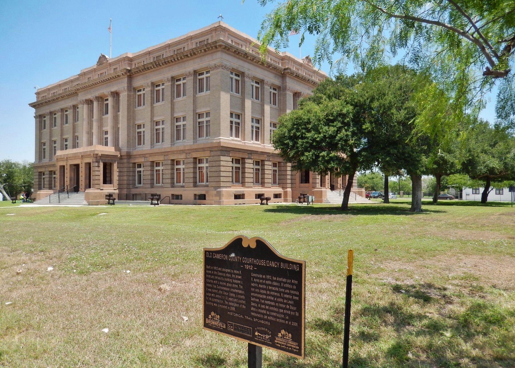 Old Cameron County Courthouse / Dancy Building Marker (<i>wide view; courthouse in background</i>) image. Click for full size.