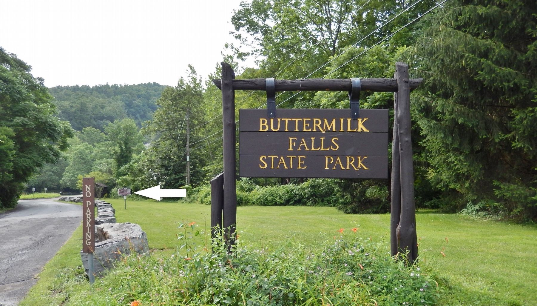 Buttermilk Falls State Park entrance (<i>marker visible in background beside road</i>) image. Click for full size.