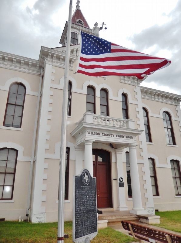 The Flores de Abrego Family and Floresville Marker (<i>Wilson County Courthouse in background</i>) image. Click for full size.