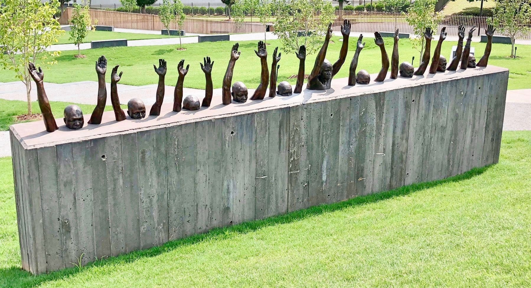 Bronze monument by Hank Willis Thomas titled <i>Raise Up</i>. image. Click for full size.