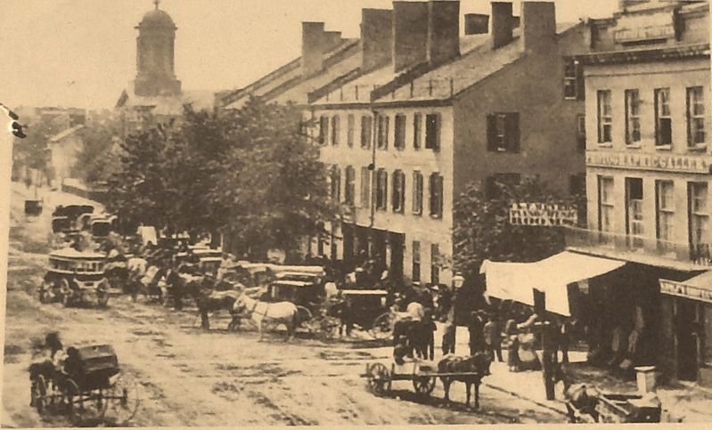 Marker detail: The three story building (ca. 1860) with numerous vehicles in front of it image. Click for full size.