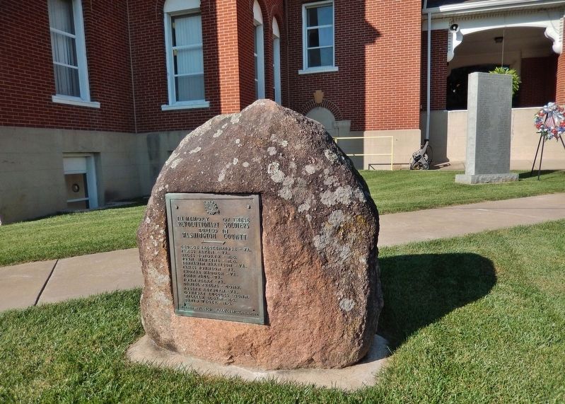 Revolutionary Soldiers Marker (<i>marker on boulder; Washington County Courthouse in background</i>) image. Click for full size.