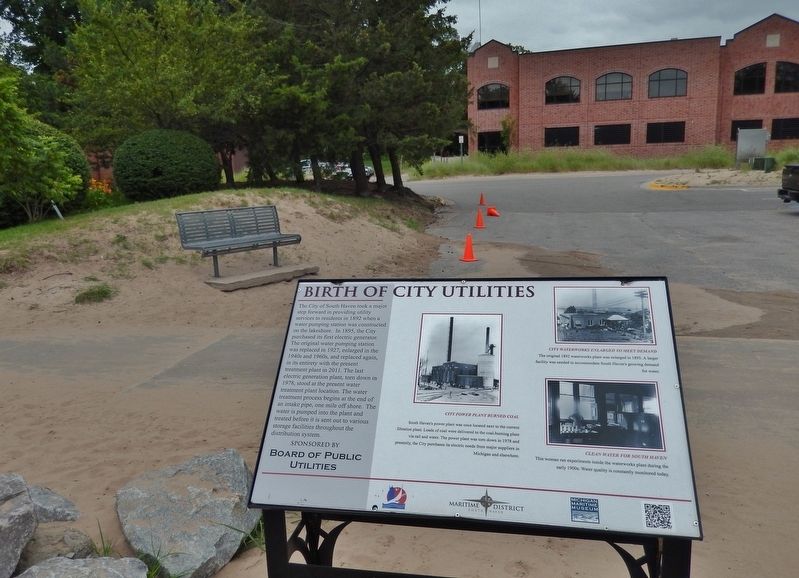 Birth of City Utilities Marker (<i>wide view; old public utilities building in background</i>) image. Click for full size.