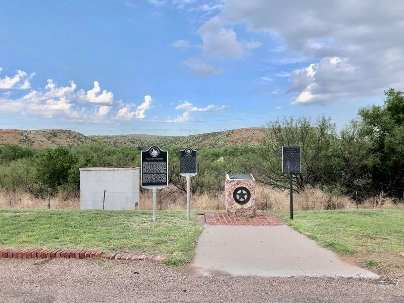 Wide view of monument and other nearby markers, close to the Canadian River. image. Click for full size.