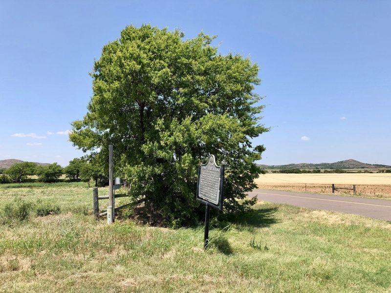 View of marker looking west towards former post. image. Click for full size.